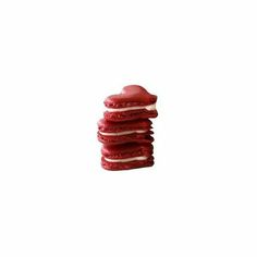 a stack of red cookies sitting on top of each other