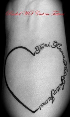 a black and white photo of a heart tattoo