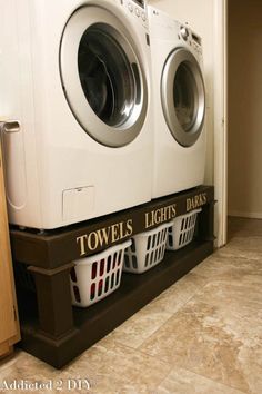 a washer and dryer stacked on top of each other in a laundry room