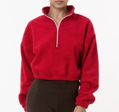 Fall Long Sleeve Sweats With Elastic Waistband, Red Sweats For Fall Loungewear, Red Fall Loungewear Sweats, Red Sweats With Ribbed Cuffs For Fall, Winter Fleece Tops With Ribbed Waistband, Red Fleece Sporty Sweater, Sporty Tops With Elastic Cuffs For Winter, Red Athleisure Top For Fall, Red Sporty Sweats For Winter