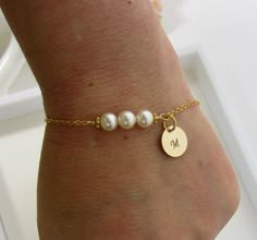 This pearls bracelet is made with 3 pearls and a hand stamped initial. Will be a keepsake piece for your Mother or Mother in Law from your wedding day. ** Hand Stamped with the Initial of your choice ** 6 mm Swarovski Pearls ** Initial Disc 10mm * 14k Gold Filled, or Sterling Silver chain & components * Length measures 6.75 inches long + 1 inch extension chain, if you prefer slightly longer or shorter length, please drop a note a check out ♥ CHECKOUT INSTRUCTIONS Please include a note at che Bridal Party Bracelets, Pearl Bracelet Wedding, Custom Bracelet, Customized Jewelry, Handmade Wire Jewelry, I Love Jewelry