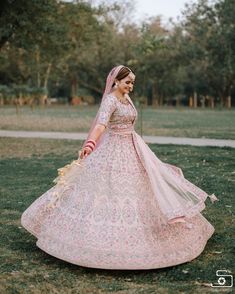 a woman in a pink and white wedding dress