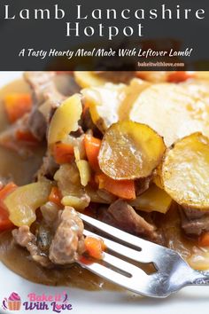 a white plate topped with meat and veggies next to a fork on top of it