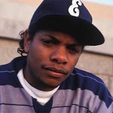 a young man wearing a hat and striped shirt