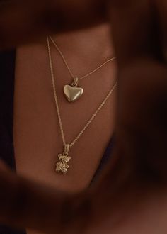 A bold show of love—hold this modern heirloom close to your heart.Luxuriously weighted and fits on any chain.Layer with a link chain for texture. Features a Petite Rope Chain.Our puffed heart pendant is solid, not hollow, and has significant weight to it. 14k solid gold—always Silver pendant weight: Approx 4.4g Gold pendant weight: Approx 5.5g Measurements: 14.5mm x 14.5mm Teddy Pendant, Teddy Bear Bracelet, Teddy Bear Pendant, Teddy Bear Necklace, Bear Jewelry, Fall Rings, Sterling Silver Heart Pendant, Bear Pendant, Bear Necklace