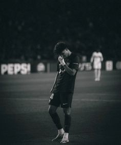 a man standing on top of a soccer field