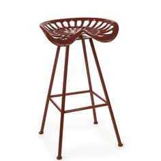 a red stool with an intricate design on the back and seat, in front of a white background