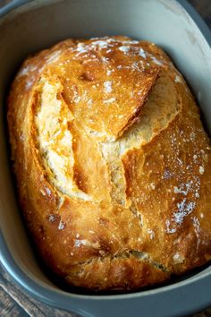 a loaf of bread in a blue bowl