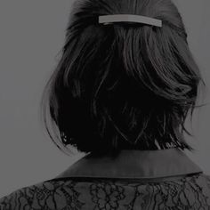 the back of a woman's head wearing a hair clip