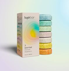 a box of lubaar soap next to it's packaging on a pastel background