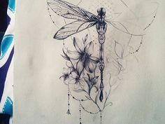 a drawing of a dragonfly sitting on top of a piece of paper with flowers