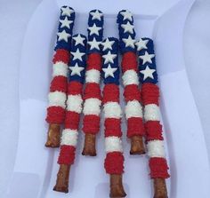 patriotic candy sticks are made to look like the american flag