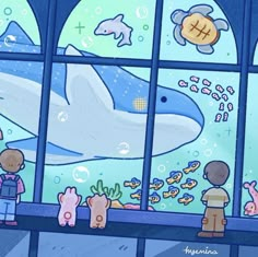 two children looking out the window at an aquarium with dolphins and other marine animals in it