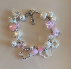 Such a pretty pink charm bracelet! About 8.5 inches. Charm Bracelet Pink, Pink Charm Bracelet, Simplistic Jewelry, Handmade Charm Bracelets, Bracelet With Charms, Pink Charm, Pretty Jewelry Necklaces, Hime Gyaru, Pink Angel