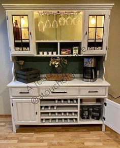 a white cabinet with wine glasses on it