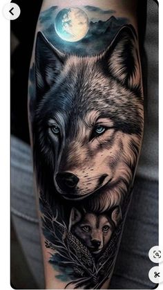 a man's arm with an image of two wolfs and the moon on it