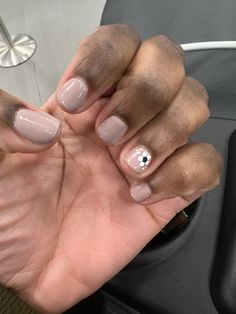 Short nails with nude nylon gel color and a white flower design on ring finger, in the bottom corner of the nail. Boy Manicure Ideas, Masculine Nail Designs Men, Stud Nail Designs, Masculine Nail Designs, Gell Nails, Flower Nail Designs