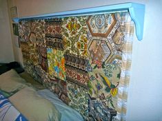 the headboard is covered with colorful fabric