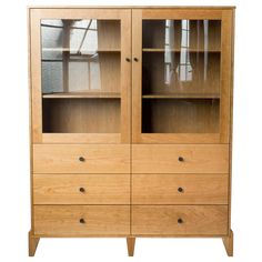 a wooden cabinet with glass doors and drawers