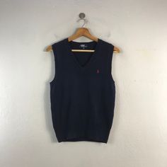 PLEASE READ DESCRIPTION BELOW BEFORE BUYING👇🏻 *ITEM:Polo Ralph Lauren Vest *ITEM DETAILS: 👇🏻 Please be aware that all vintage items will usually show a few signs of wear or fading due to age, but anything visible such as stains or holes, and serious flaws have been photographed.For any further information on this item please contact us and we will be happy to help. *SIZE:SMALL *ACTUAL SIZE MEASUREMENT: 👇🏻 *PIT TO PIT(WIDTH):17"INCHES *LENGTH(FROM SHOULDER): 23"INCHES  *ALL MEASUREMENTS ARE TAKEN WITH THE GARMENT FLAT ON THE GROUND *VIEW FULL SHOP HERE: https://www.etsy.com/shop/Tracstore *SHIPPING: (WITH ONLINE TRACKING NUMBER ) *DHL EXPRESS SHIPPING:4-6 BUSINESS DAYS *Don't Worry About Customs Tax or Fees. I usually Declare As 'Gifts' And Low Value  *ANY QUESTION WILL ANSWER WITHIN Polo Ralph Lauren Vest, V Neck Style, Mens Formal Vest, Casual Outfits Fashion, Ralph Lauren Vest, Fashion Vest, Formal Vest, Vintage Polo Ralph Lauren, Mens Formal