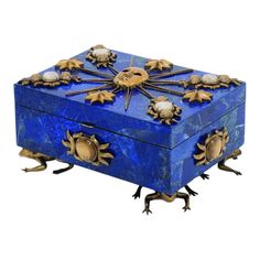 an ornate blue box with gold decorations on it