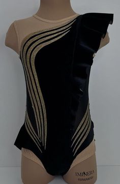 a mannequin wearing a black and gold bodysuit