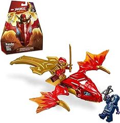 a toy with a red and gold dragon on it's back end next to a box