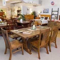 a room filled with lots of wooden furniture and decorating items on top of carpeted flooring