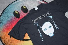 Vintage Evanescence shirt  - Item is used and vintage. - Measurements: Pit to pit - 19,4" Lenght - 24,4" Tag says M Fits like S WORLDWIDE SHIPPING After shipping, I'll give you the tracking number! If you have some questions, please ask Best regards, Igor and Nazar Evanescence Shirt, Goth Rock, Rock Band Tees, Black Goth, Evanescence, Rock Band, Band Tees, Rock Bands, Tracking Number