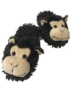 two black and white monkey slippers on top of each other