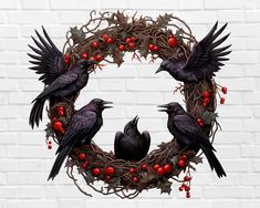 two black birds sitting on top of a wreath