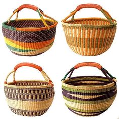 four baskets with handles are shown in different colors