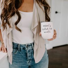 a woman holding a coffee mug that says, umm ombree