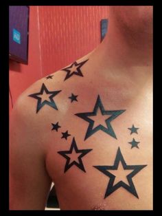 a man's chest with stars on it