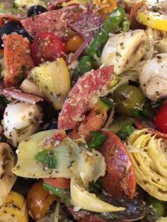 a close up of a plate of food with meat and veggies