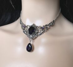 "Choker: This elegantly ornate necklace is made with antique silver tone centerpieces, featuring lavish baroque details. Its mesmerizing design is accented with dazzling deep violet purple glass crystals/jewels. Decorated portion is 4\" wide and 2 1/2\" tall in the very center. Necklace length is adjustable 14\"-17\" with soldered stainless steel cable chain, lobster clasp and extender. If you would like a different length, please send us a message. Earrings: These dainty and elegantly ornate ea Black And Purple Jewelry, Dark Green And Dark Purple Wedding, Purple Black And Silver Wedding, Dark Purple Jewelry, Baroque Details, Labyrinth Ball, Dark Purple Wedding, Gothic Antique, Ornate Necklace