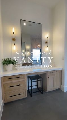 a bathroom with vanity, mirror and stool