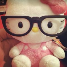 a hello kitty stuffed animal wearing glasses