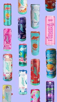 many different types of soda cans on a purple background