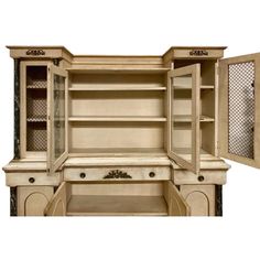 an old fashioned wooden cabinet with glass doors and shelves on the front, open to reveal its contents