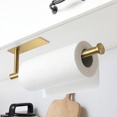 a roll of toilet paper is hanging on the wall