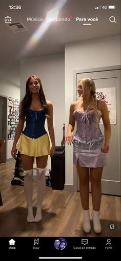 two women in costumes standing next to each other