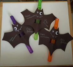 three bats with happy halloween written on them