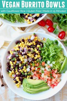 two white bowls filled with black beans, corn and veggie burrito bowls