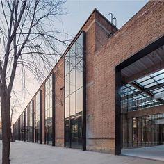 a brick building with lots of glass doors