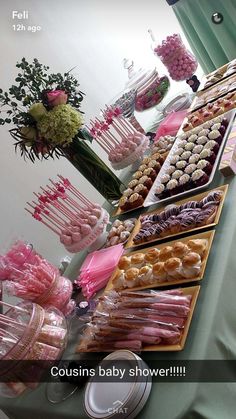 a table filled with lots of desserts and sweets on top of eachother