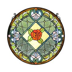 a stained glass window with a rose on it's center and leaves in the middle