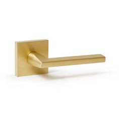 a brass door handle on a white background