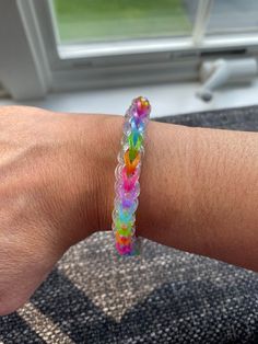 a person's arm with a colorful bracelet on it