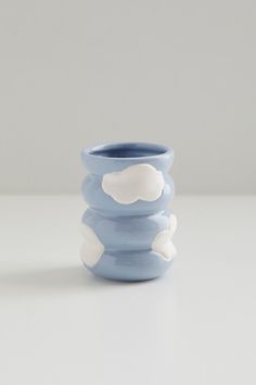 a blue and white vase sitting on top of a table